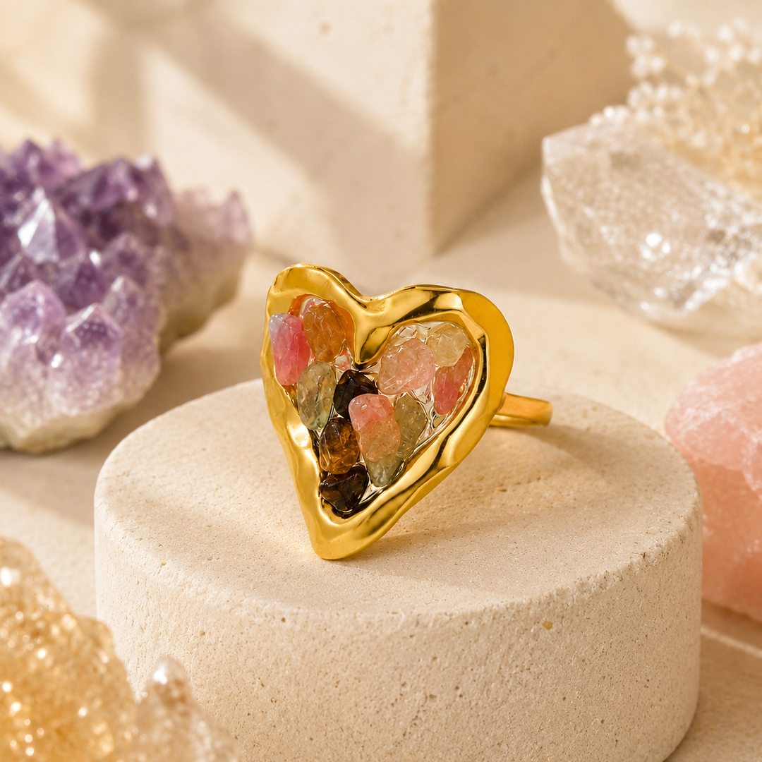 Orphaya gold heart ring filled with multicolor natural crystal chips in pink, green, amber and earthy tones